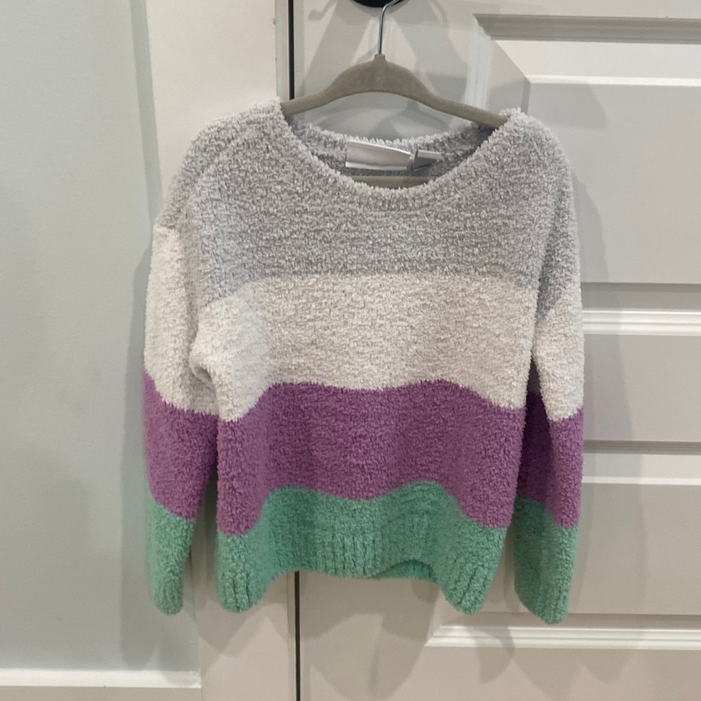Children place sweater
